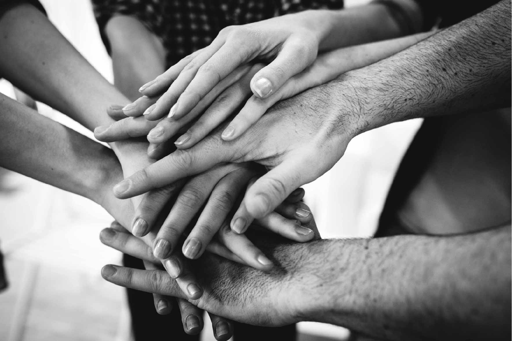 people joining hands together