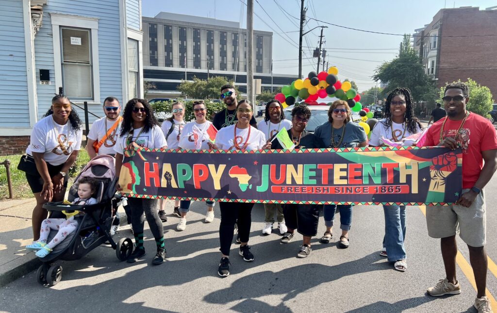 Adult & Child BCA members walk in the Juneteenth parade.