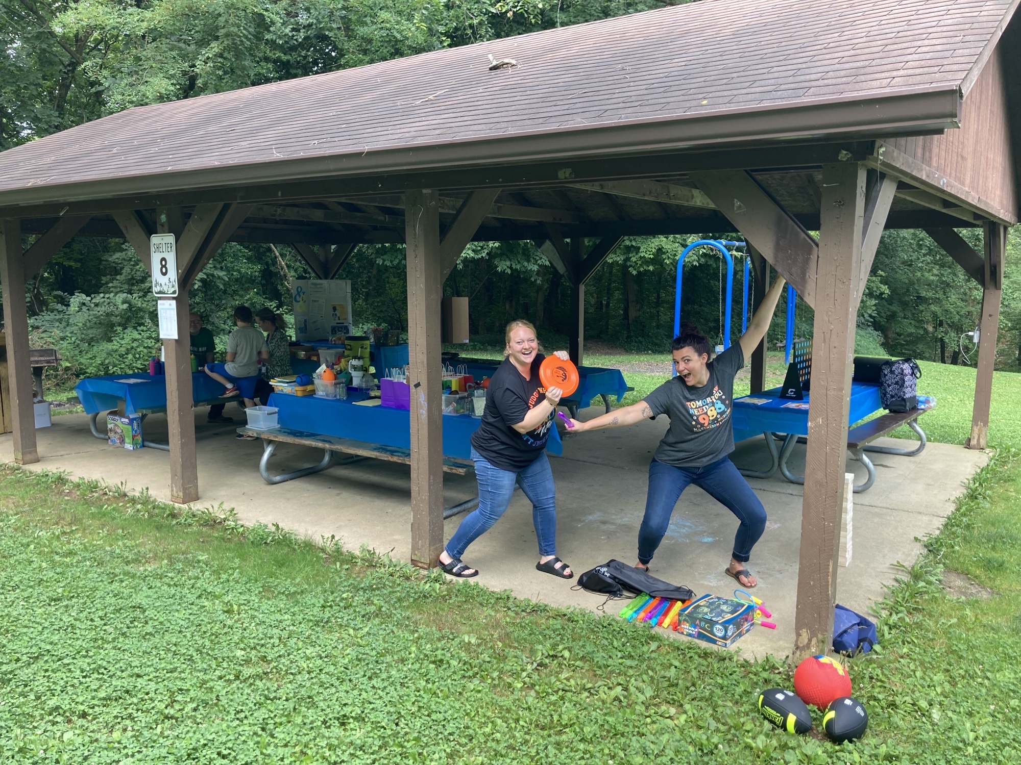 School Based Staff prepare for an event at a park